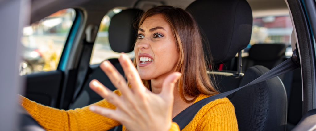 Frustrated woman driving experiencing stress needing assistance and support.